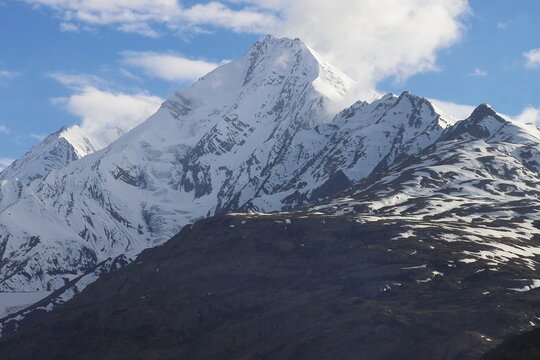 scenic mountain landscape, snowcapped himalayas of lahaul and spiti, extreme terrain. adventure travel, trekking and mountaineering in himachal pradesh, india