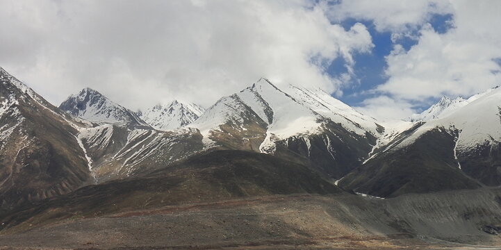 scenic mountain landscape, snowcapped himalayas of lahaul and spiti, extreme terrain. adventure travel, trekking and mountaineering in himachal pradesh, india
