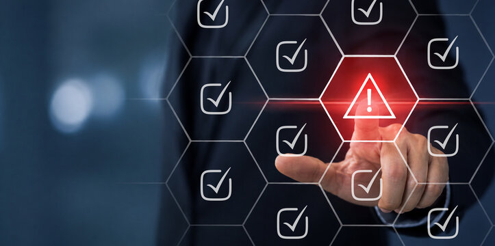 Problem and error warning concept. Businessman touching on triangle caution warning sign, automatic warning system for notification error and maintenance. Incident, risk, contingency management.