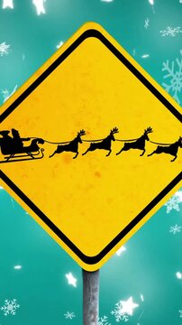 Animation of santa in sleigh over snow falling
