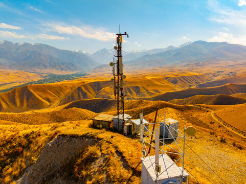 Aerial View of Communication Tower on Golden Hillside