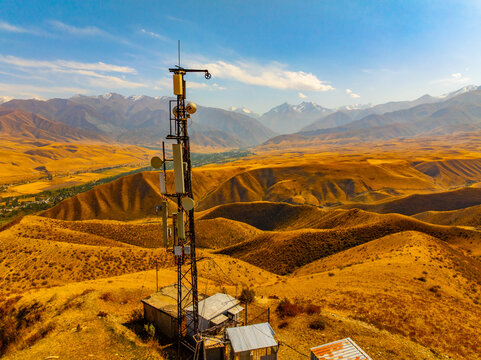Aerial View of Communication Tower on Golden Hillside