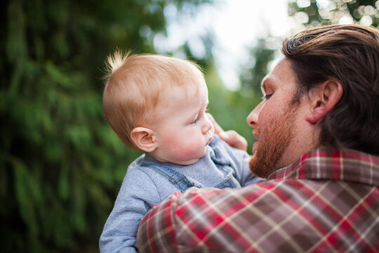 Father and baby son sharing a tender moment