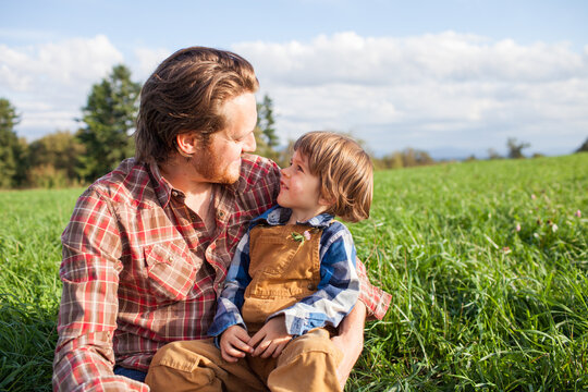 Outdoor portrait of a father and son sharing an intimate moment