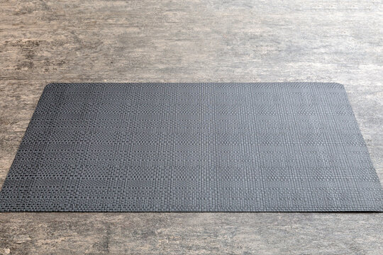 Perspective view of grey tablecloth for food on cement background. Empty space for your design