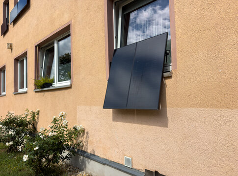 Solar panel on a house window for renewable energy in the city