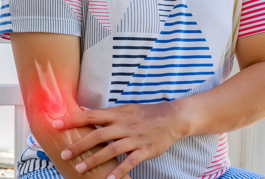 Elbow pain showing an Asian man holding his elbow due to discomfort for specialized medical treatment and orthopedic care illustration.
