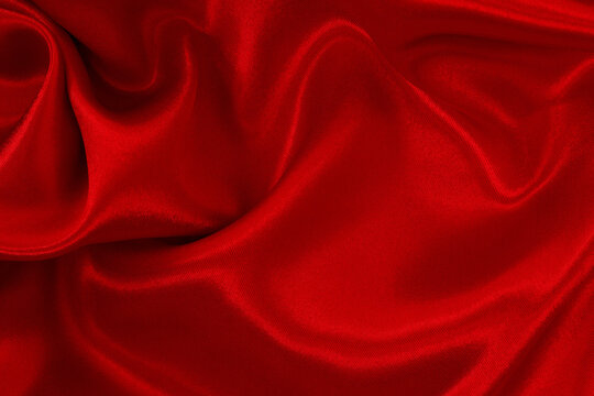Red fabric cloth texture for background and design art work, beautiful crumpled pattern of silk or linen.