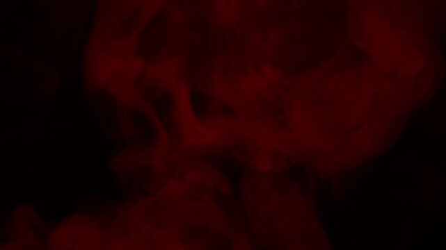Real Red Smoke on Black Background