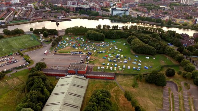 Wide 4K 60FPS aerial video of the Comhaltas Fleadh Cheoil na h&Eacute;ireann campsite at Fleadh Belfast 2026. Produced with Rec709 colour.