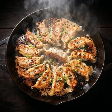  pan of sizzling Yaki-mandu 야끼만두  (crispy pan-fried pork dumplings) arranged in a star pattern, showing golden lace-skirt crust edges. T