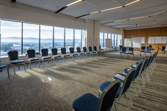 Wide angle perspective of modern conference room set up for corporate workshop