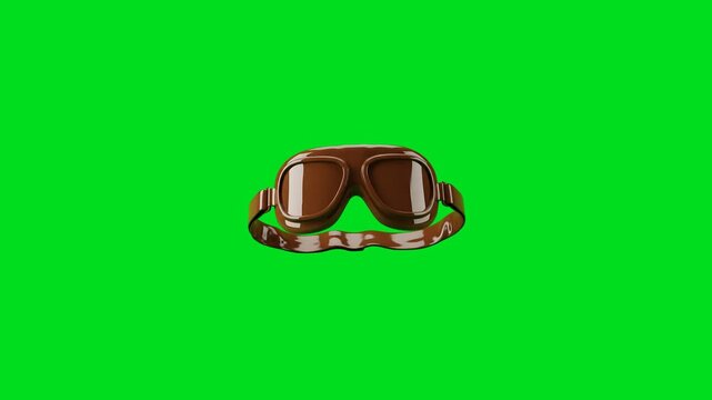 Classic vintage brown aviator goggles isolated on a bright green background