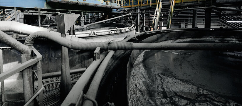 Industrial pipes transporting Flotation processing for copper ore on factory, fine pulp with bubbles, industry concentration plant
