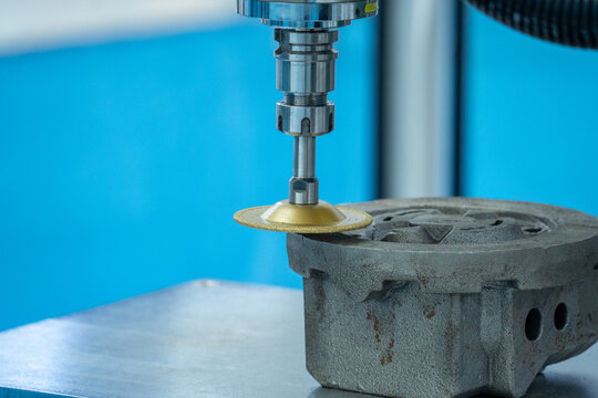 Industrial Polishing Machine Working on Metal Workpiece