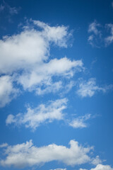 Fototapeta premium Clear blue sky with scattered white clouds