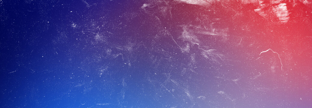 Abstract grainy film texture with blue and red gradient background overlay for cinematic photography and design projects.