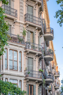Traditional Facade with Balconies in Eixample District, Barcelona, Modernist Architecture, Ornate Railings, Shutters