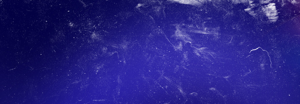 Abstract grainy film texture with dark blue gradient background overlay for cinematic photography and digital projects.