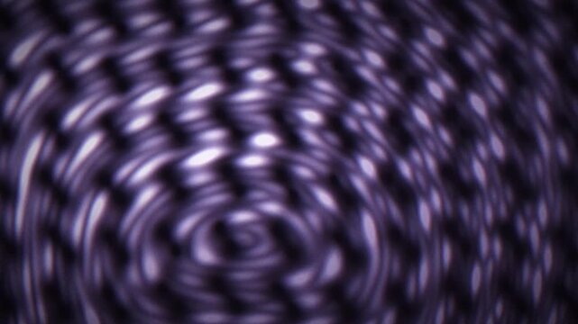 Concentric wave ripples in purple and blue gather over a grungy texture, with a soft gradient and dark cinematic grain in a seamless loop.