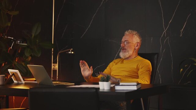 Excited middle-aged AI company CEO celebrates successful product breakthrough
