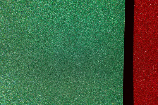  green glitter field with a red sparkling border and copy space for Christmas greetings,website headers, seasonal discounts and retail advertising.Christmas holiday sale