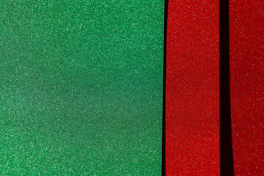  green glitter field with a red sparkling border and copy space for Christmas greetings,website headers, seasonal discounts and retail advertising.Christmas holiday sale