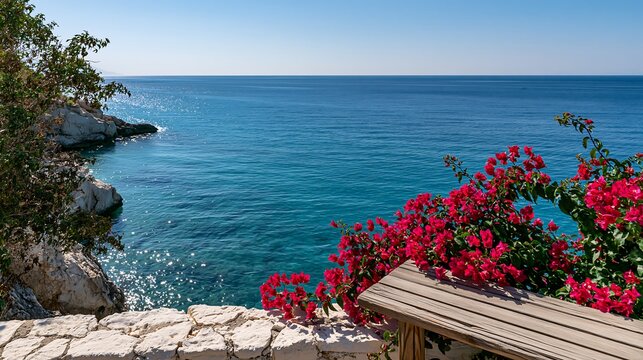Stunning coastal view with vibrant red flowers and serene blue sea water