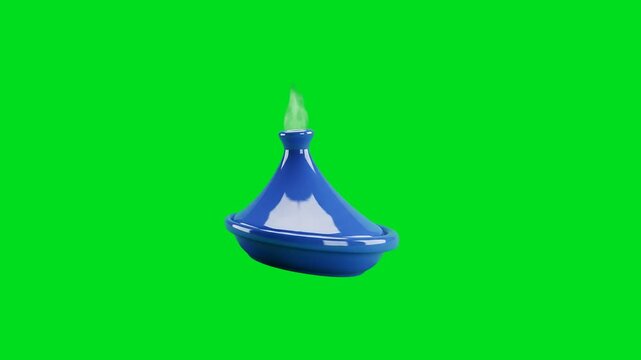 A shiny blue ceramic tagine pot with green steam on a bright green screen