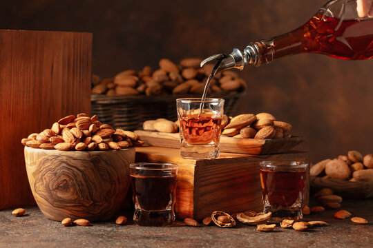 Italian liqueur Amaretto with almonds nuts.
