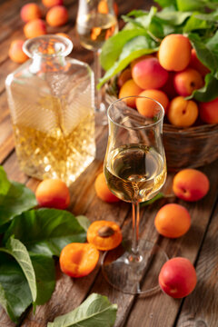 Apricot liqueur or grappa and fresh apricots.