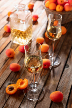 Apricot liqueur or grappa and fresh apricots.