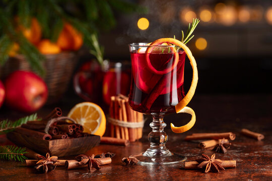 Christmas mulled wine with citrus, apples, cinnamon, anise, and rosemary.