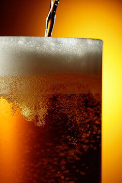 Glass of tasty beer with foam, closeup.