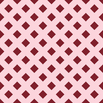 Seamless pattern created from small dark pink diamonds on a pale pink background