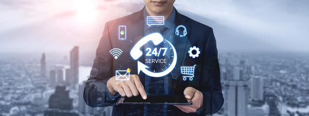 Obraz premium Business Professional Using Tablet to Access 24-7 Customer Service with Digital Icons in Cityscape Background Representing Modern Technology and Connectivity. Entropy.