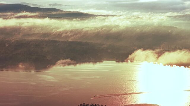 Lake Schroon Clarks Island WOL jet skis summer golden hour sunset mist low clouds aerial drone harbor view Up State New York landscape Town of Schroon Lake Pharaoh Mtn Adirondack Mountains follow pan