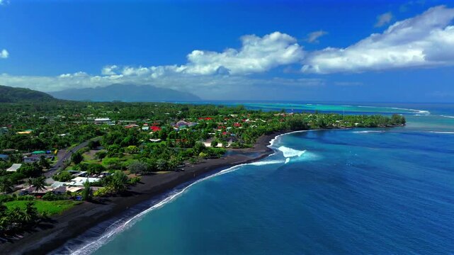 Taharuu Beach landscape volcanic black sand beach Mount Orohena Tahiti coastline French Polynesia aerial drone view Papeete Vaira'o surfspot South Pacific Ocean waves sunny morning blue sky backwards