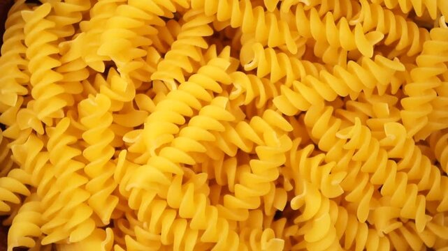 Rotation of fusilli pasta as a texture close up