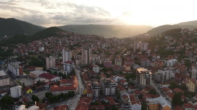 Drone Shot of Sunset Above Uzice Serbia, Hillside Buildings and Hills in Summer Season