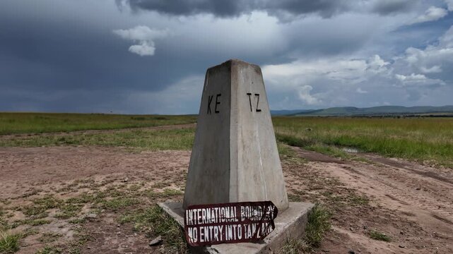 Concrete border marker between Kenya and Tanzania in the Masai Mara National Reserve