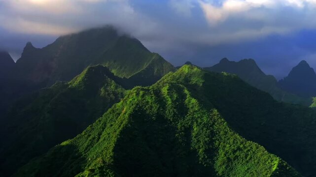 Towering mountains peaks of Teahupo'o Tahiti Ito Volcano South Pacific Ocean Island French Polynesia aerial drone sunset clouds Tara Huhurahi Ridge Mount Ronui Aorai Orohena Vaiau River Valley circle