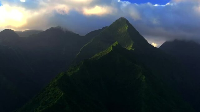 Mountains peaks of Teahupo'o Tahiti Ito Volcano South Pacific Ocean Island French Polynesia aerial drone sunset sunny clouds Tara Huhurahi Ridge Mount Ronui Aorai Orohena Vaiau River Valley static