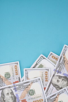 Closeup of Spread of Dollar Cash Money Over Blue background