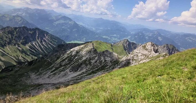 Scenic view across green ridges from Nebelhorn Oberstdorf