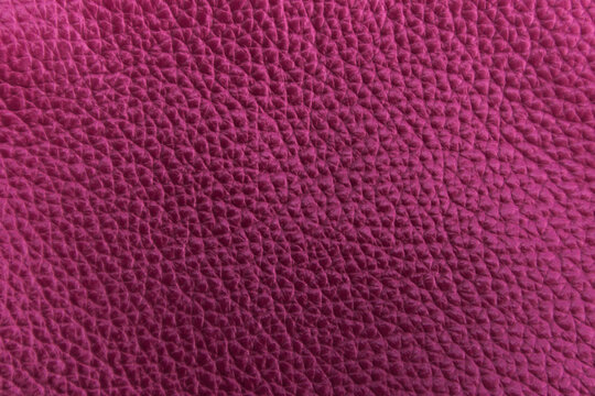 Vibrant fuchsia pink pebbled leather texture background