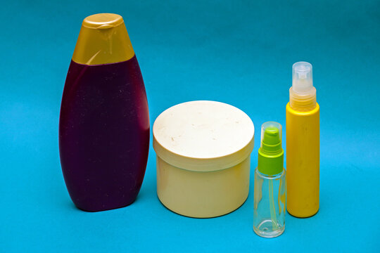Closed colourful plastic and glass toiletry bottles in home interior