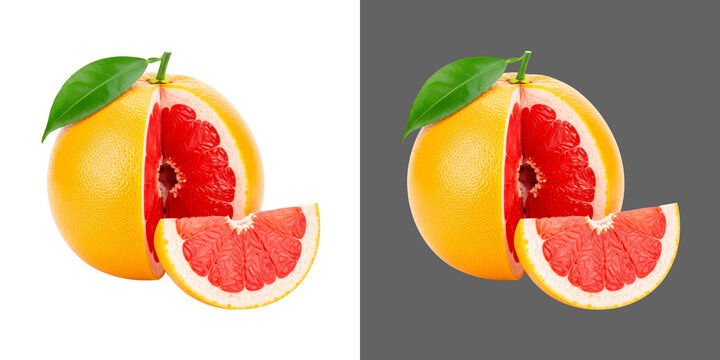 Fresh red grapefruit with a slice and green leaf studio photo