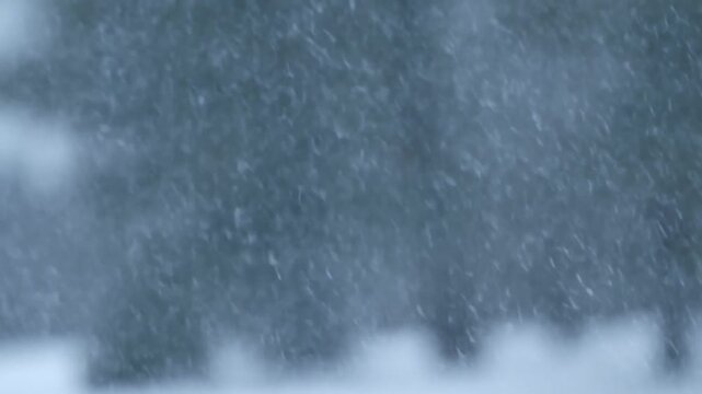 Dense Snowflakes Fill Blurred Blue Winter Background with Soft White Foreground