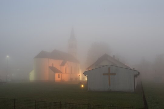 Church during foggy dull evening